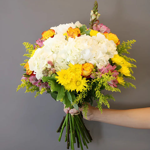 World Smile Day Yellow Flower in Hand